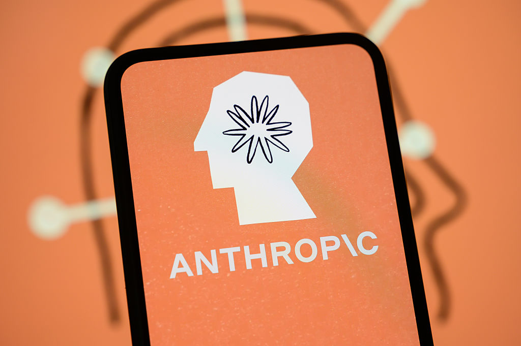Anthropic logo is displayed on the screen of a smartphone
