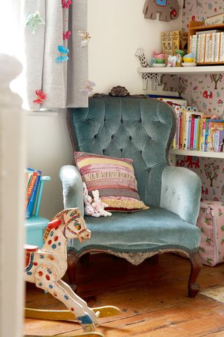 blue_velvet_chair_in_childrens_bedroom_rocking_chair_hobby_horse_curtains_butterflies