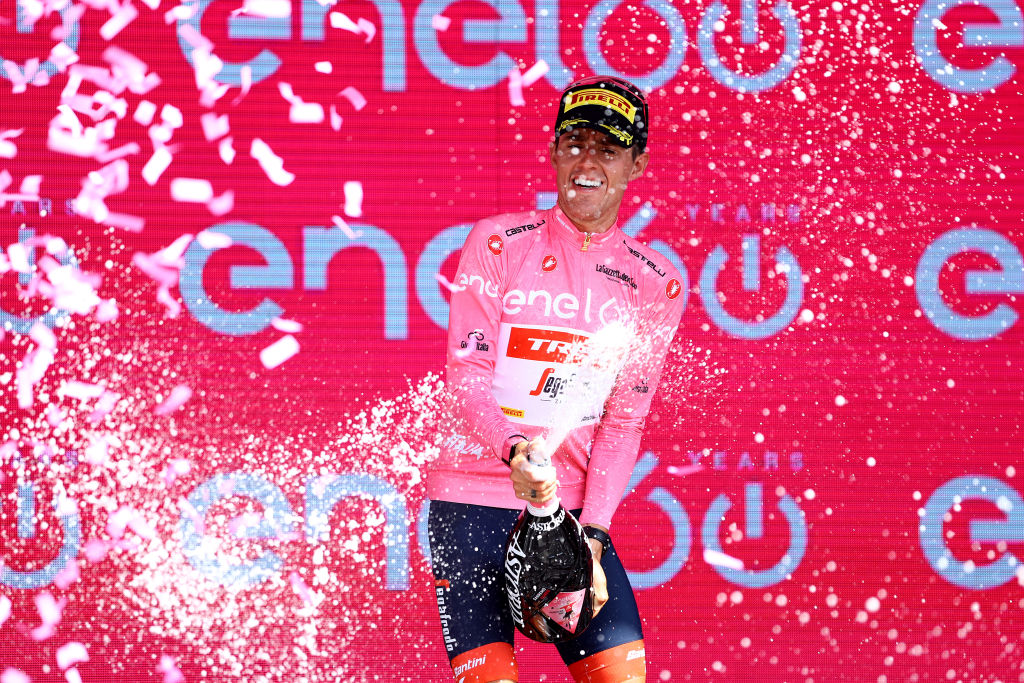 CUNEO ITALY MAY 20 Juan Pedro Lpez of Spain and Team Trek Segafredo celebrates winning the pink leader jersey on the podium ceremony after the 105th Giro dItalia 2022 Stage 13 a 150km stage from Sanremo to Cuneo 547m Giro WorldTour on May 20 2022 in Cuneo Italy Photo by Michael SteeleGetty Images