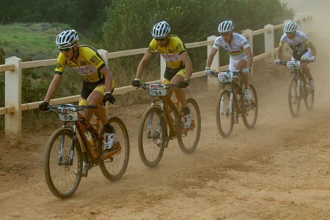 Jaroslav Kulhavy and Chritoph Sauser of Team Burry Stander-Songo break away early on with Nino Schurter and Florian Vogel of team Scott-Swisspower MTB