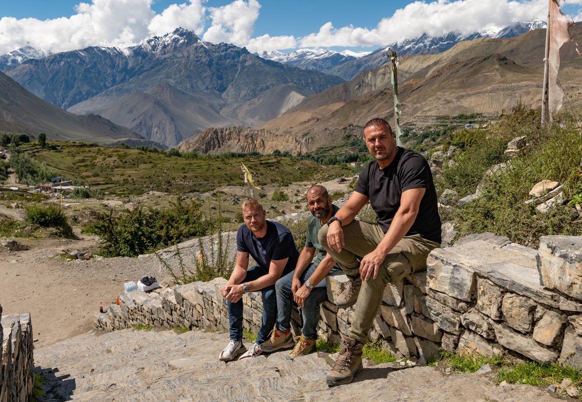 Freddie, Chris and Paddy on a wall in Nepal