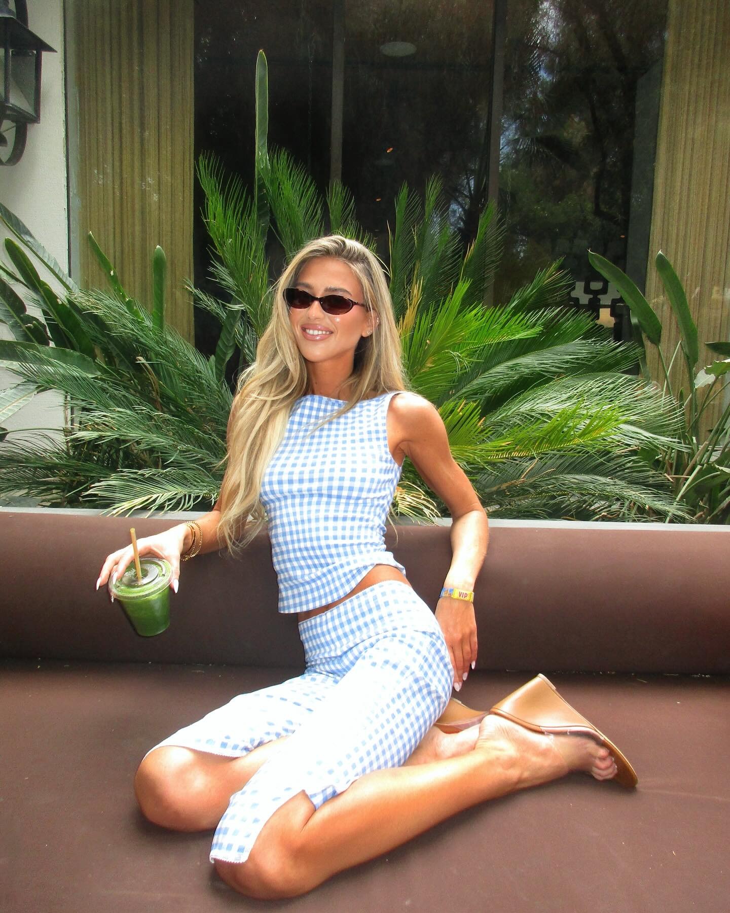 Emili Sindlev wearing gingham capri pants and tank