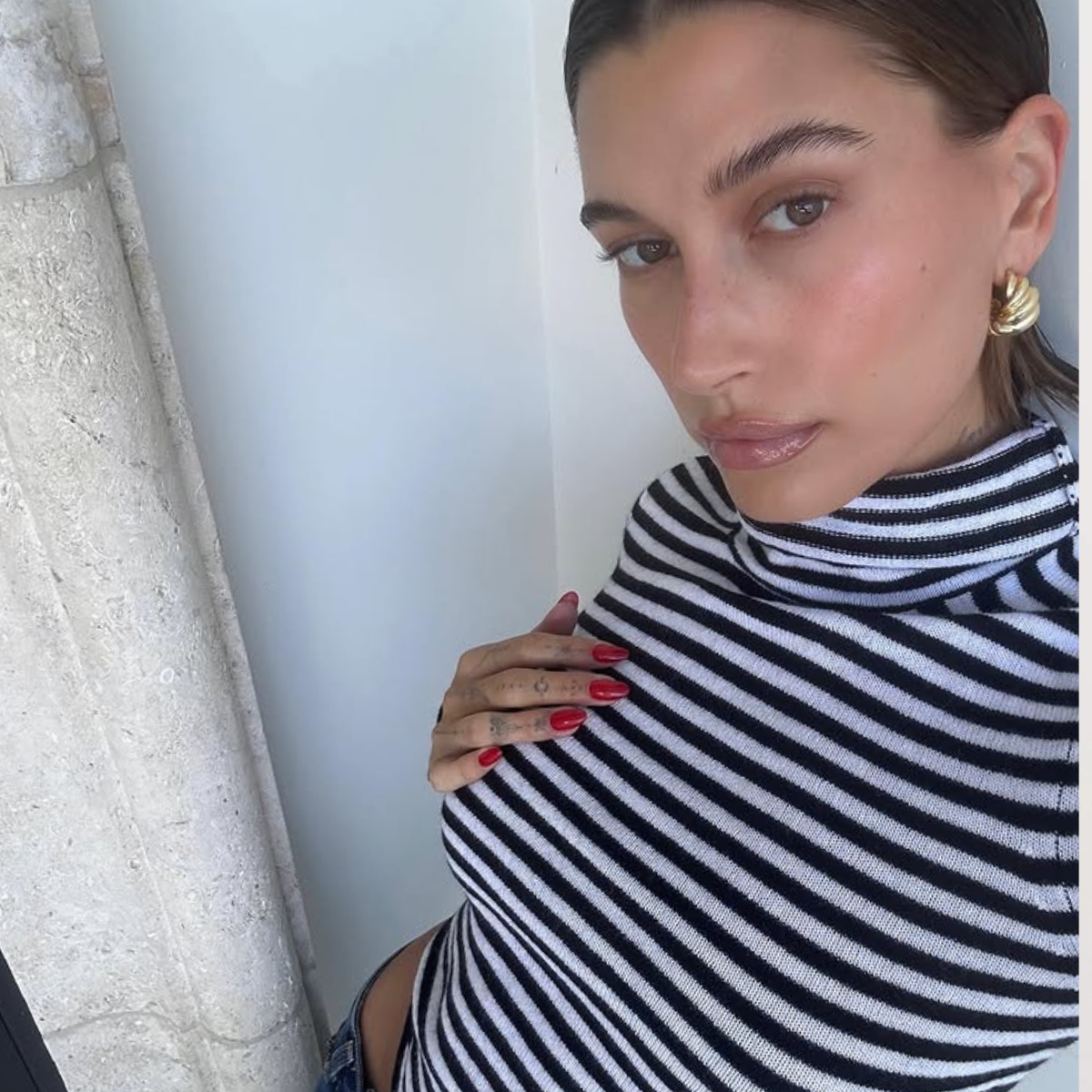 An image of Hailey Bieber wearing one of the best turtlenecks.