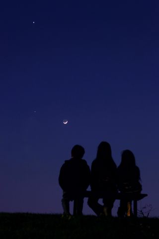 Moon, Jupiter, Venus Meet Over Italy