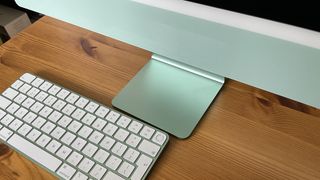 Laptop vs desktop; a photo of an Apple iMac M1