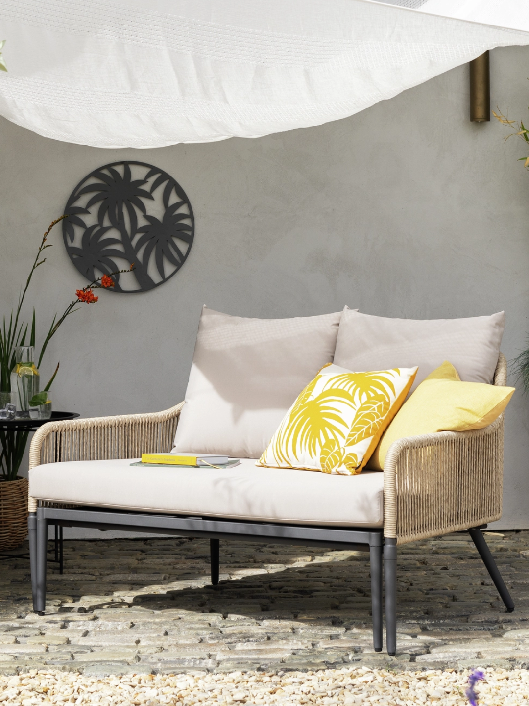 A rattan beige garden day bed from Habitat
