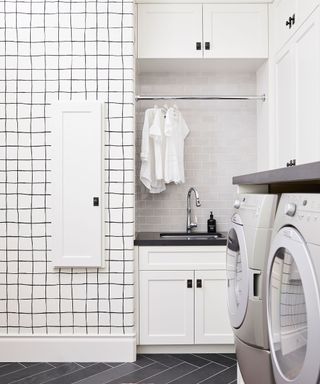 Laundry room with appliances and overhead storage