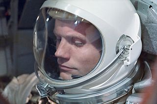 Neil Armstrong, seen here aboard Gemini 8, was the first U.S. civilian to fly into orbit. Armstrong had retired from the U.S. Navy in 1960. This photo was relatively rarely-seen until it was used as the cover of Armstrong's authorized biography, "First Man" by James Hansen. [More photos at collectSPACE.com].