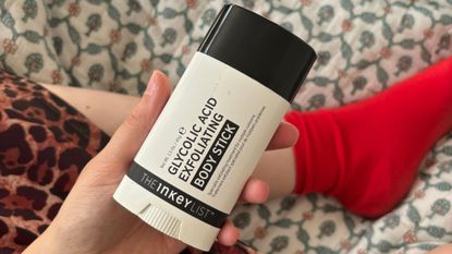 Mica Ricketts holding The Inkey List Glycolic Acid Exfoliating Body Stick