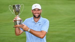 Scottie Scheffler with the Travelers Championship trophy