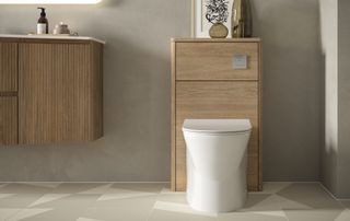toilet fitted to tiled bathroom floor