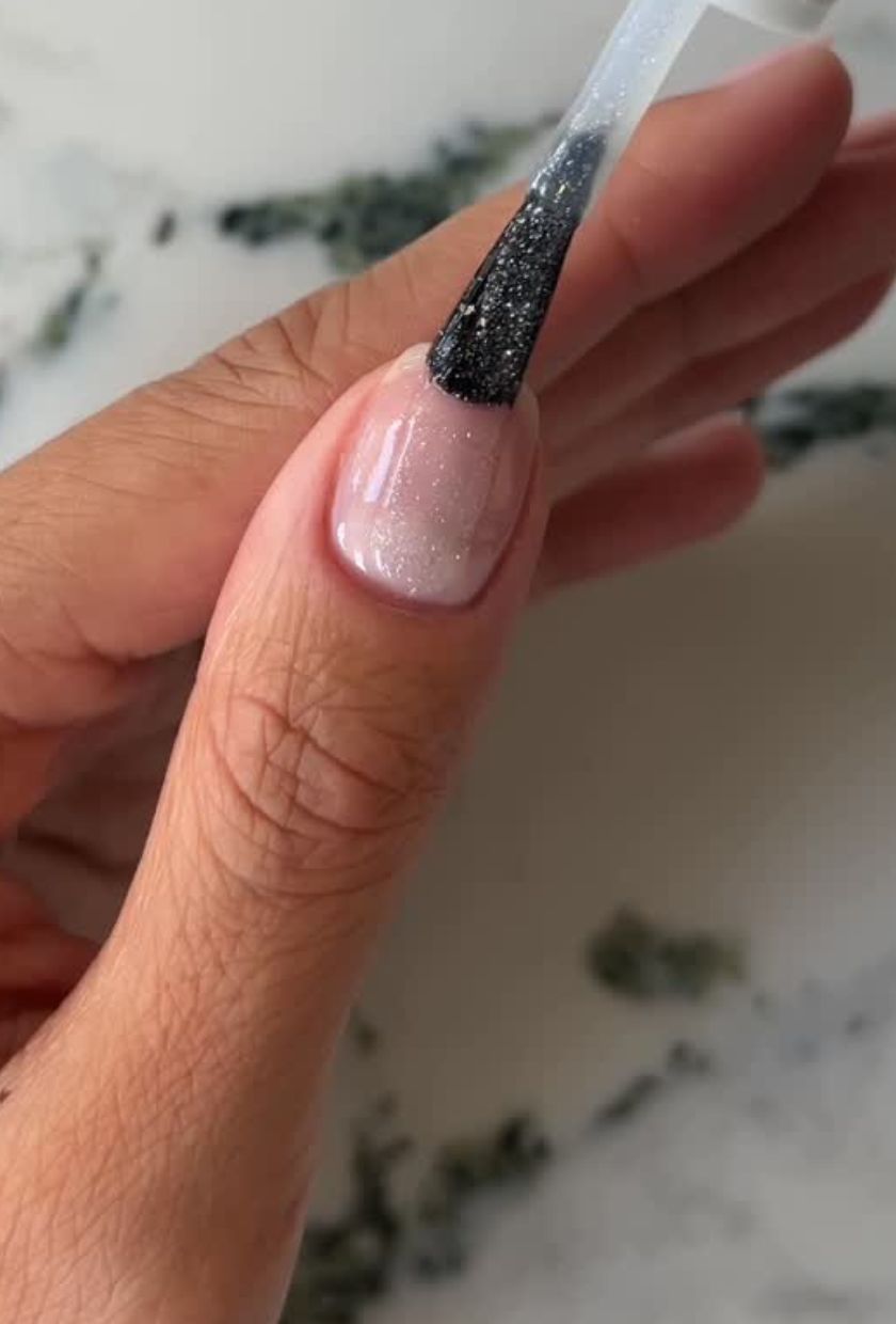 A sheer sparkly manicure by Iram Shelton