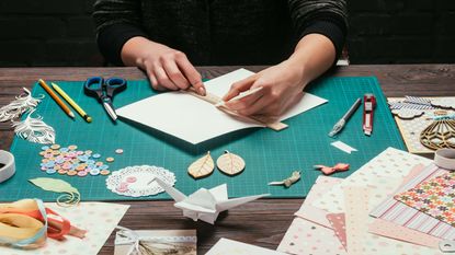 A person making cards.