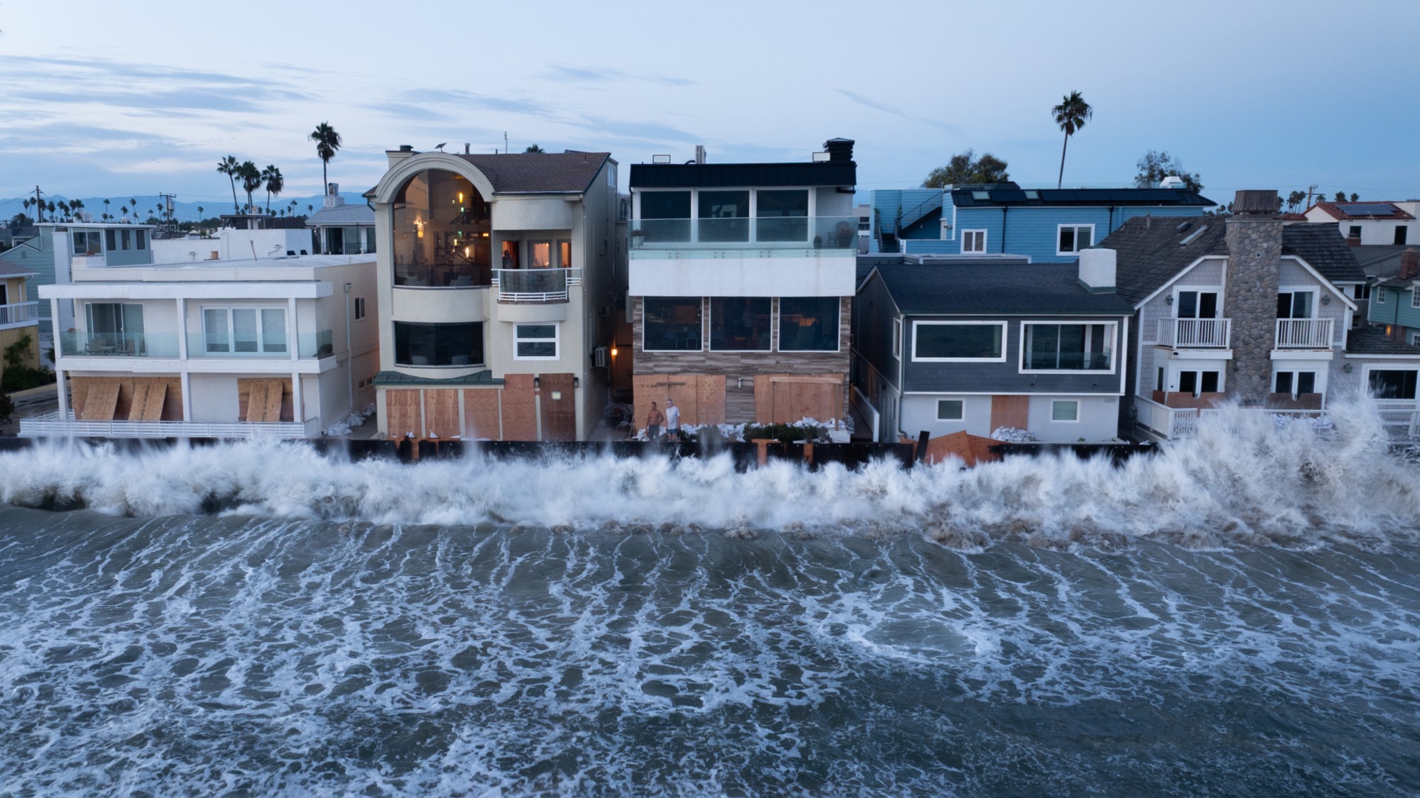 Homes off the Alamitos Peninsula braces for waves from a waning swell from Hurricane Marie combined with a 6 foot high tide that has been battering the boardwalk while flooding streets and homes on Tuesday, Sept. 8, 2026 in Long Beach, CA. (Kelvin Kuo / Los Angeles Times via Getty Images)