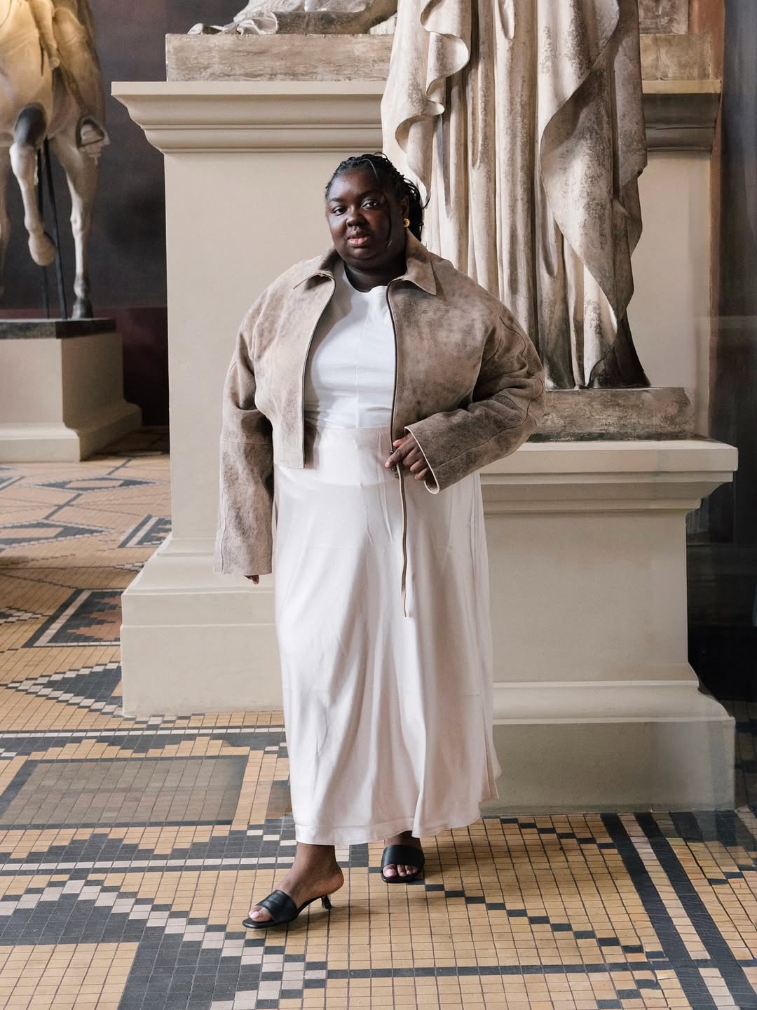 Abisola in a cropped leather jacket