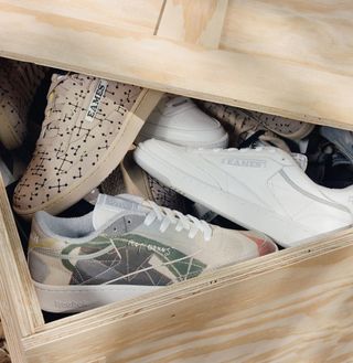 Reebok shoes in a wooden box