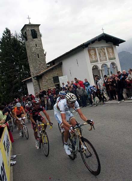 Ballan passes the top of the Ghisallo climb and rides by the chapel.