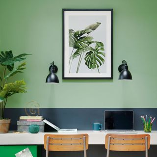 green picture frame hangs on wall of bedroom