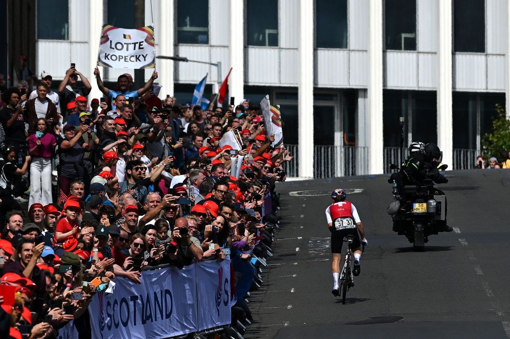 Fans cheer on solo breakaway Elise Chabbey of Switzerland