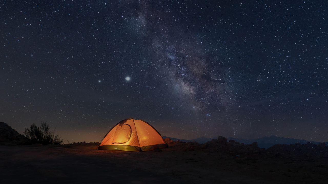 a tent pitched up at night