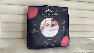 The Dreamland Hunker Down Mattress Warmer zipped up in its bag