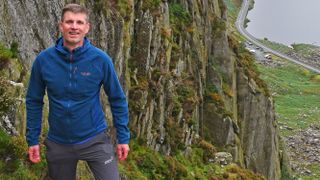 Man climbing in Rab Capacitor Hoody