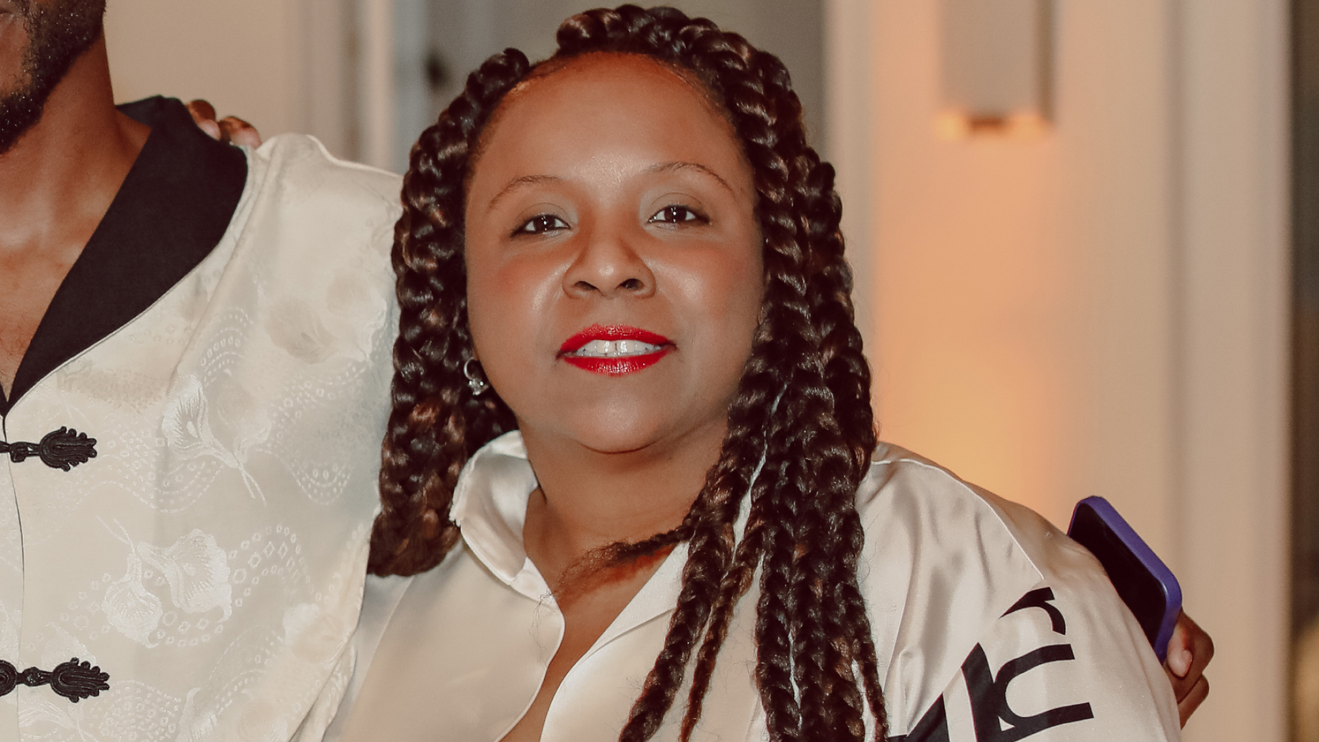 Nicole Parke wearing a black and white jacket at an album release event in Burbank, California, September 2021.