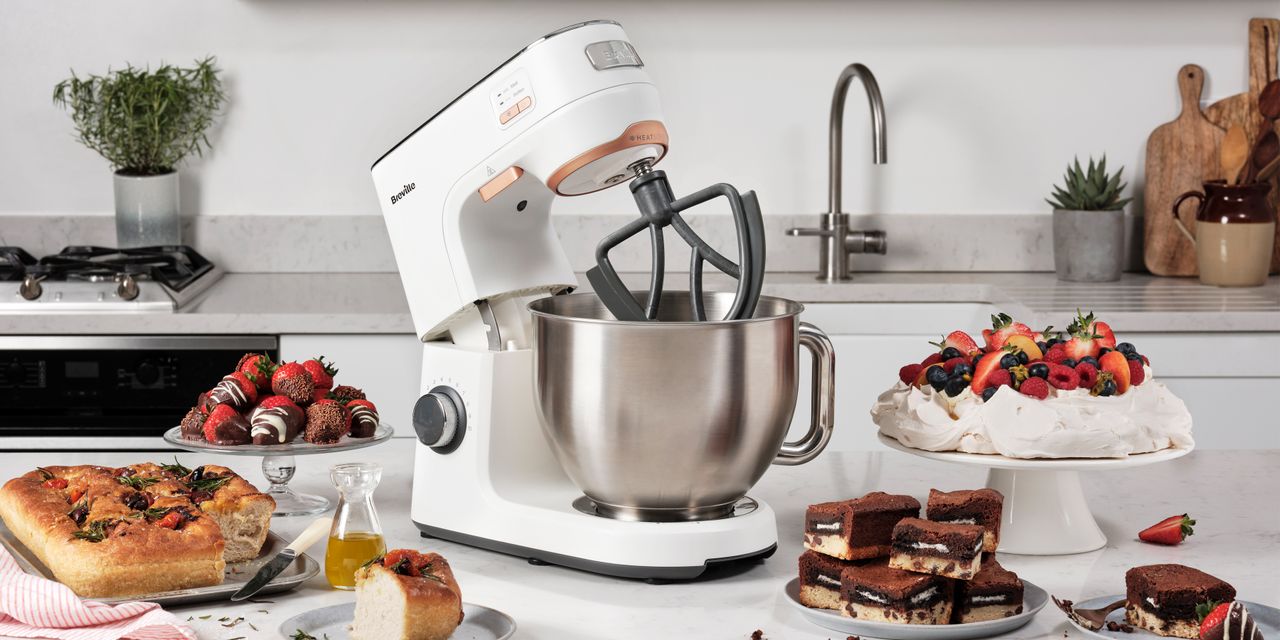 Image of Breville HeatSoft stand mixer in promotional image with baked goods on countertop 