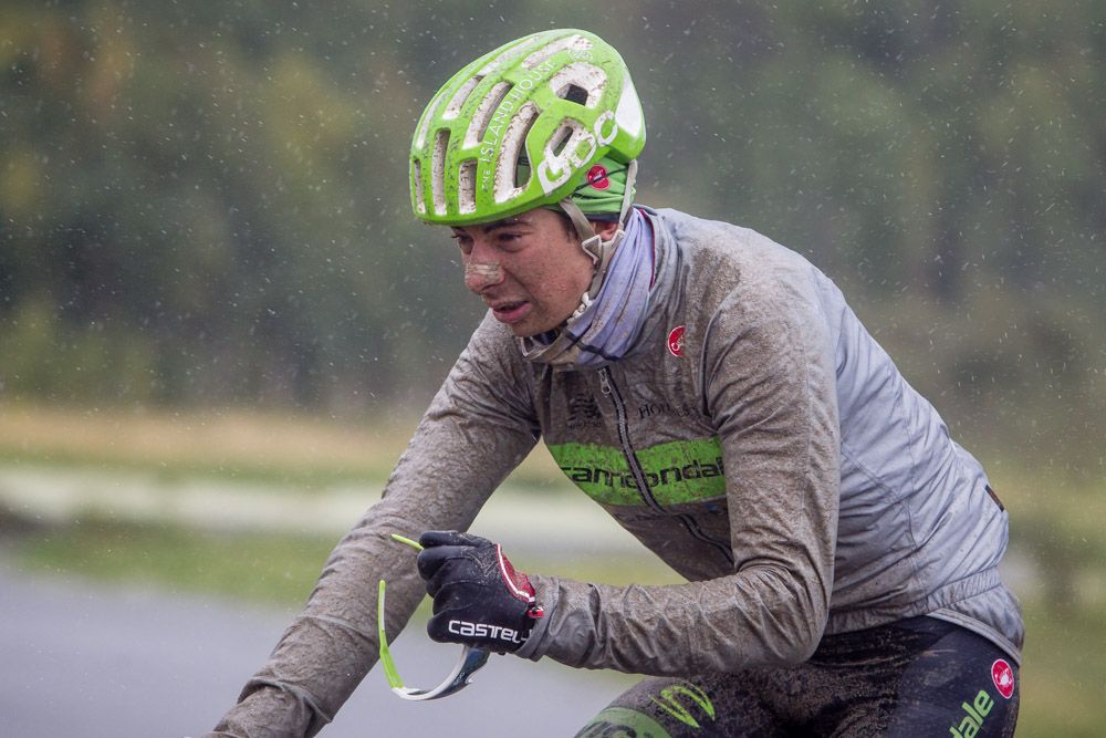 Davide Formolo (Cannondale) tries to clear his glasses in the rain and mud