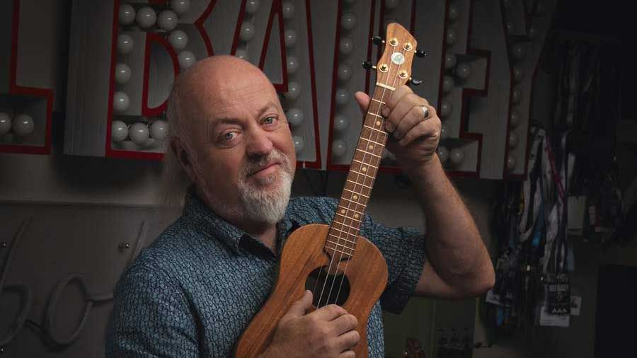 Bill Bailey holding a ukulele