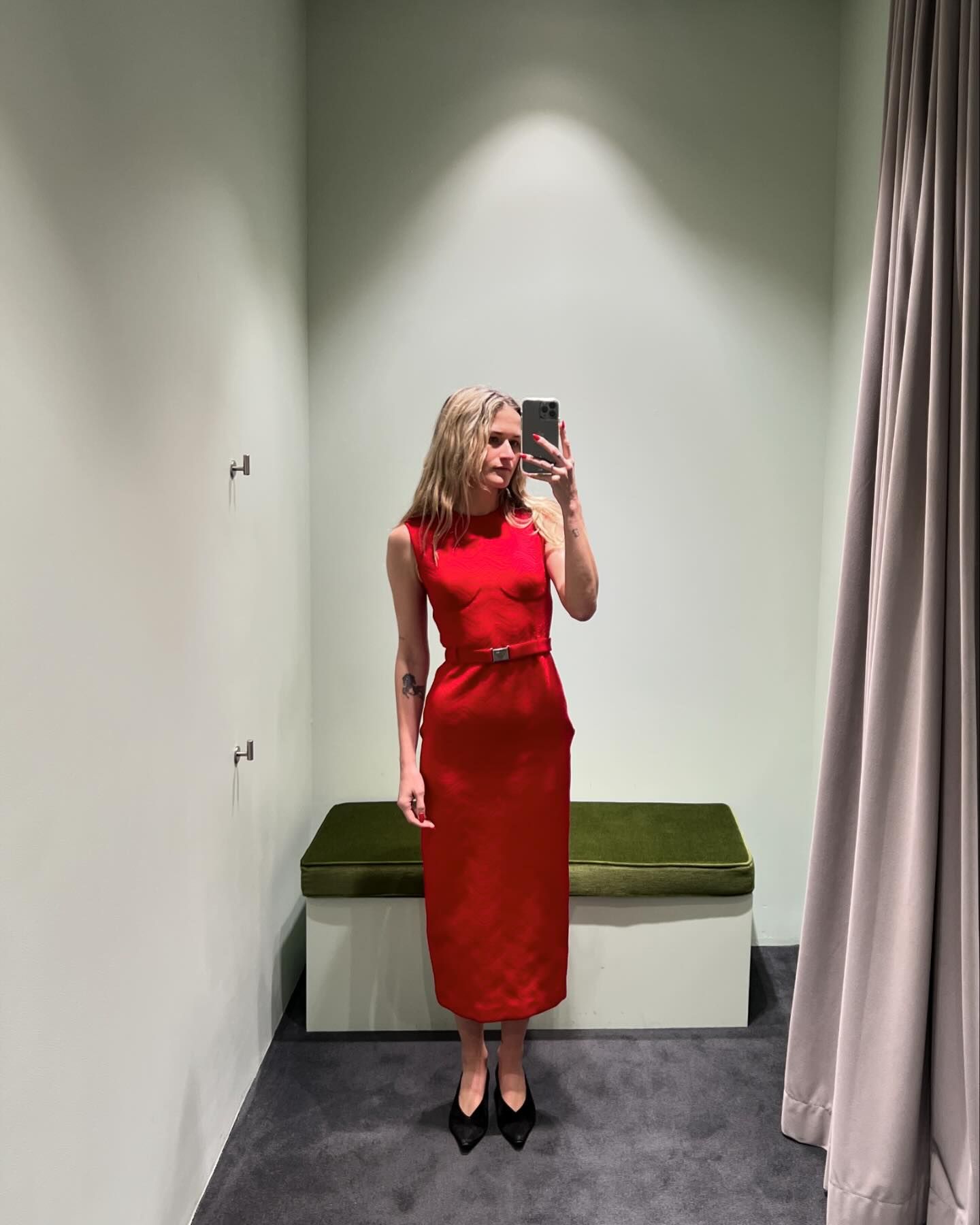 Eliza Huber wearing a red Prada dress