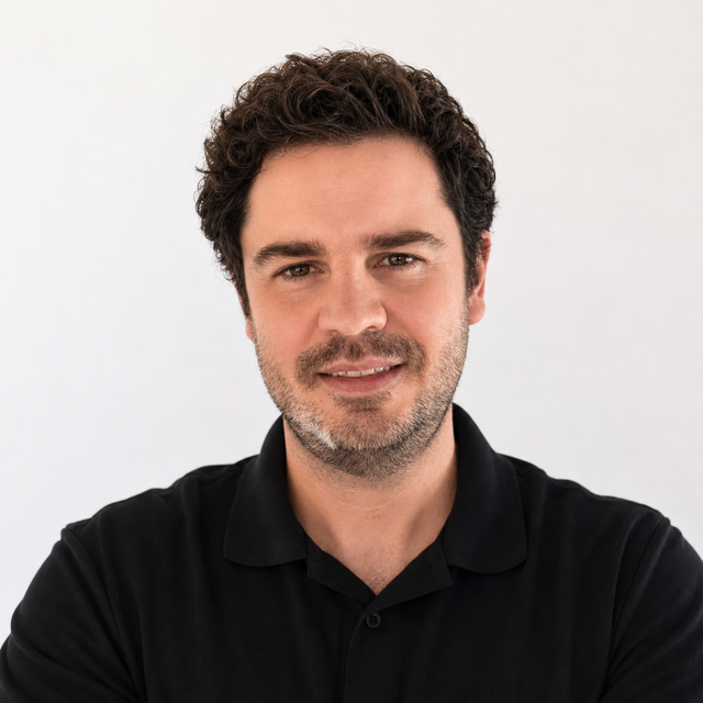 Smiling headshot of David Servinis.