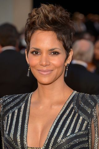 Halle Berry is pictured with a spikey pixie cut, that has shorter sides as she arrives at the Oscars at Hollywood & Highland Center on February 24, 2013 in Hollywood, California.