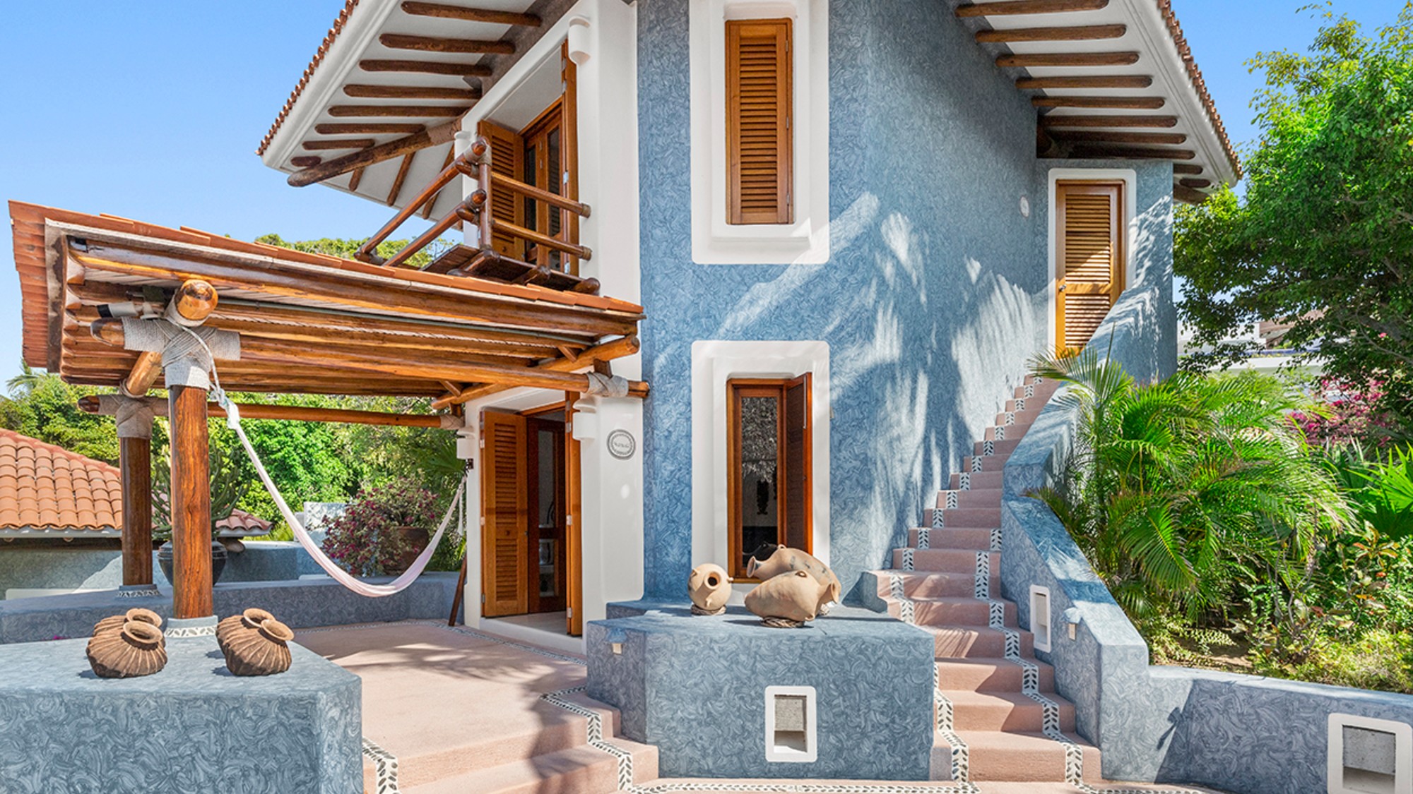 Overlooking the Gulf of Tehuantepec in a coastal town, this 1993, eight-bedroom estate has Mediterranean and Balinese influences across multiple structures.