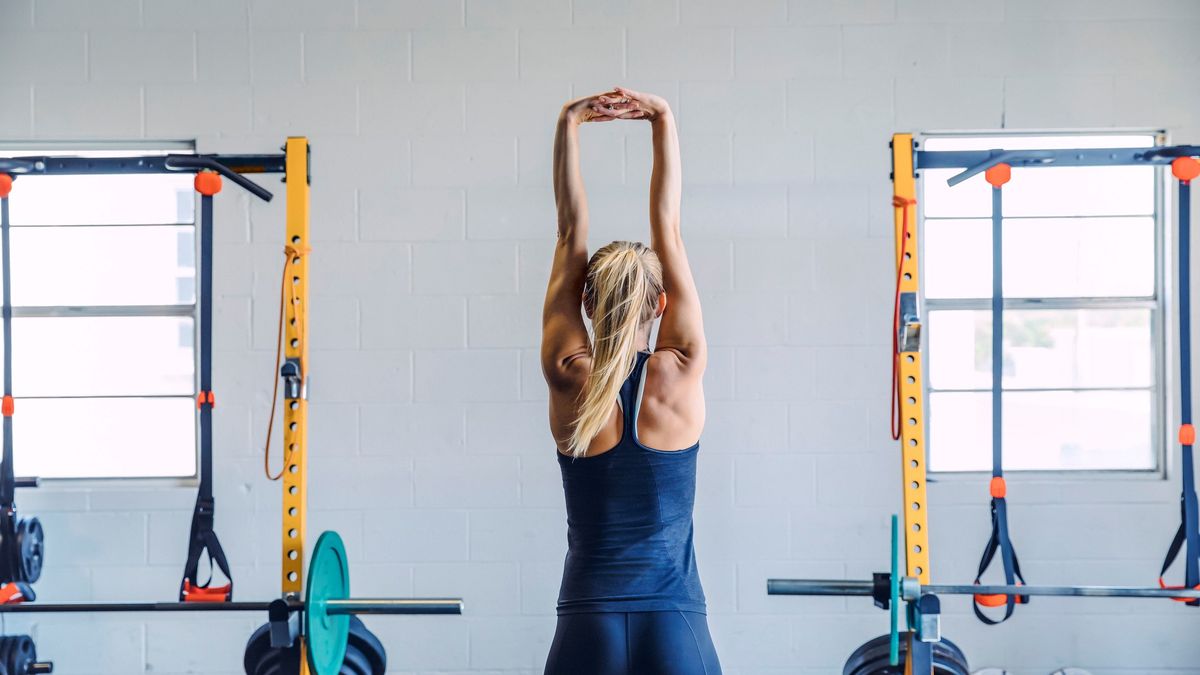 a woman doing a back stretch