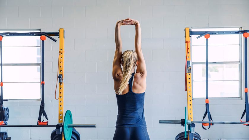 a woman doing a back stretch