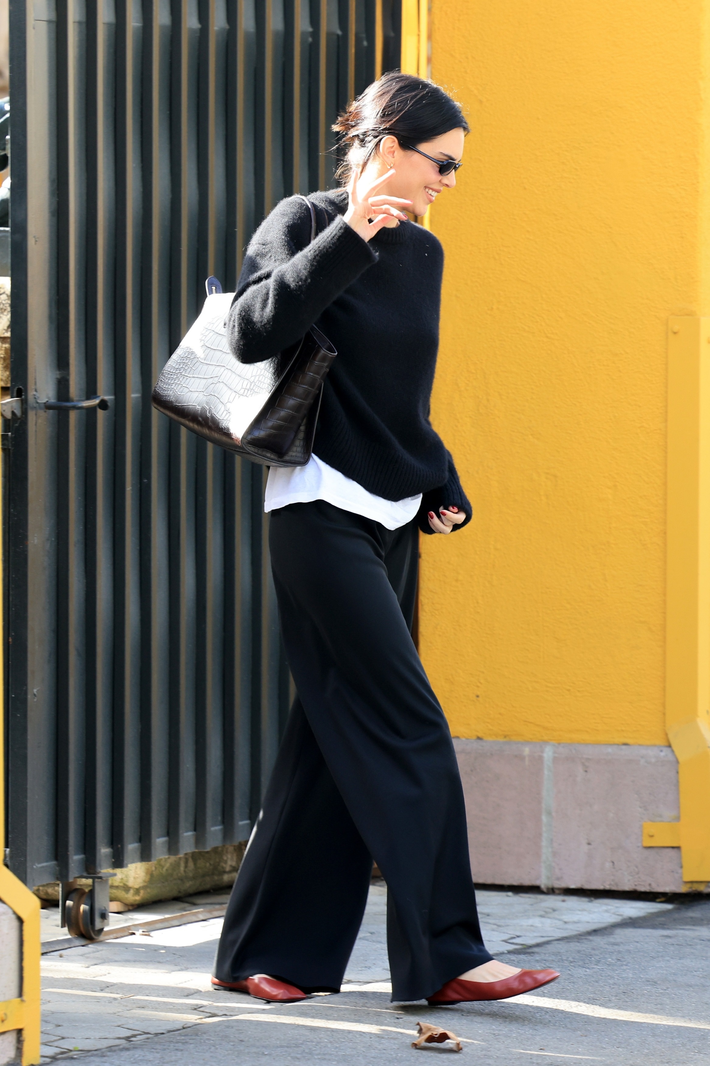 Kendall Jenner elevated her comfy-cozy crewneck and sweatpants with red ballet flats