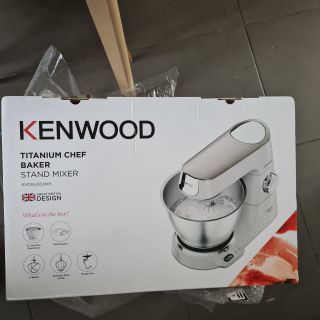 Kenwood Titanium Chef Baker box lying on dark grey tiles