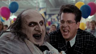 Penguin (Danny DeVito) and Josh (Steve Witting) laugh in Batman Returns