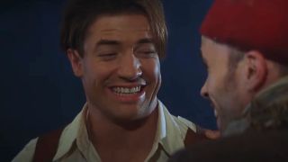 Brendan Fraser laughs with Kevin J. O'Connor at night in The Mummy.