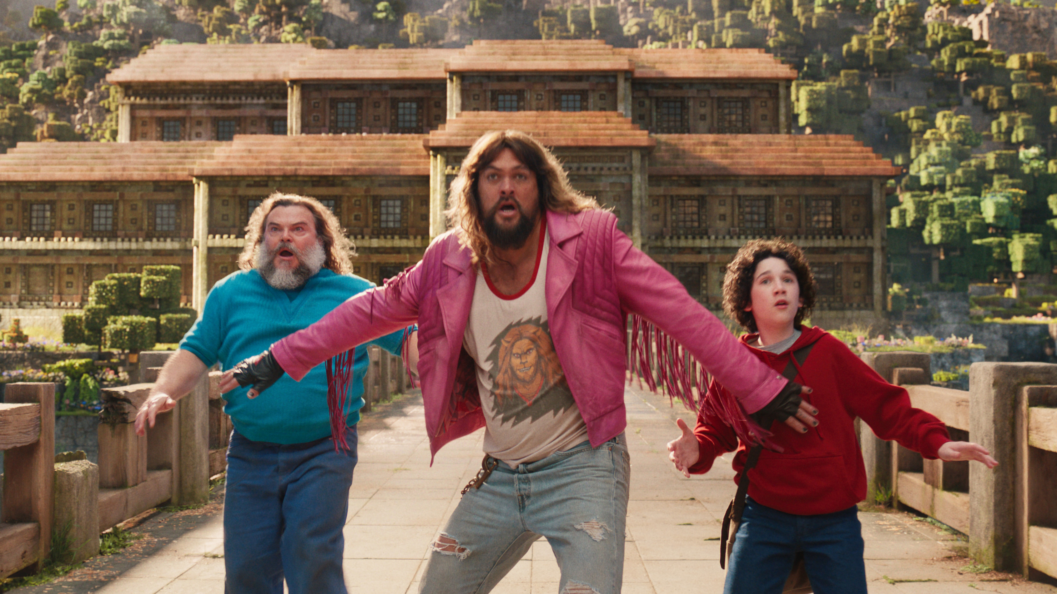 JACK BLACK as Steve, JASON MOMOA as Garrett and SEBASTIAN HANSEN as Henry in A Minecraft Movie