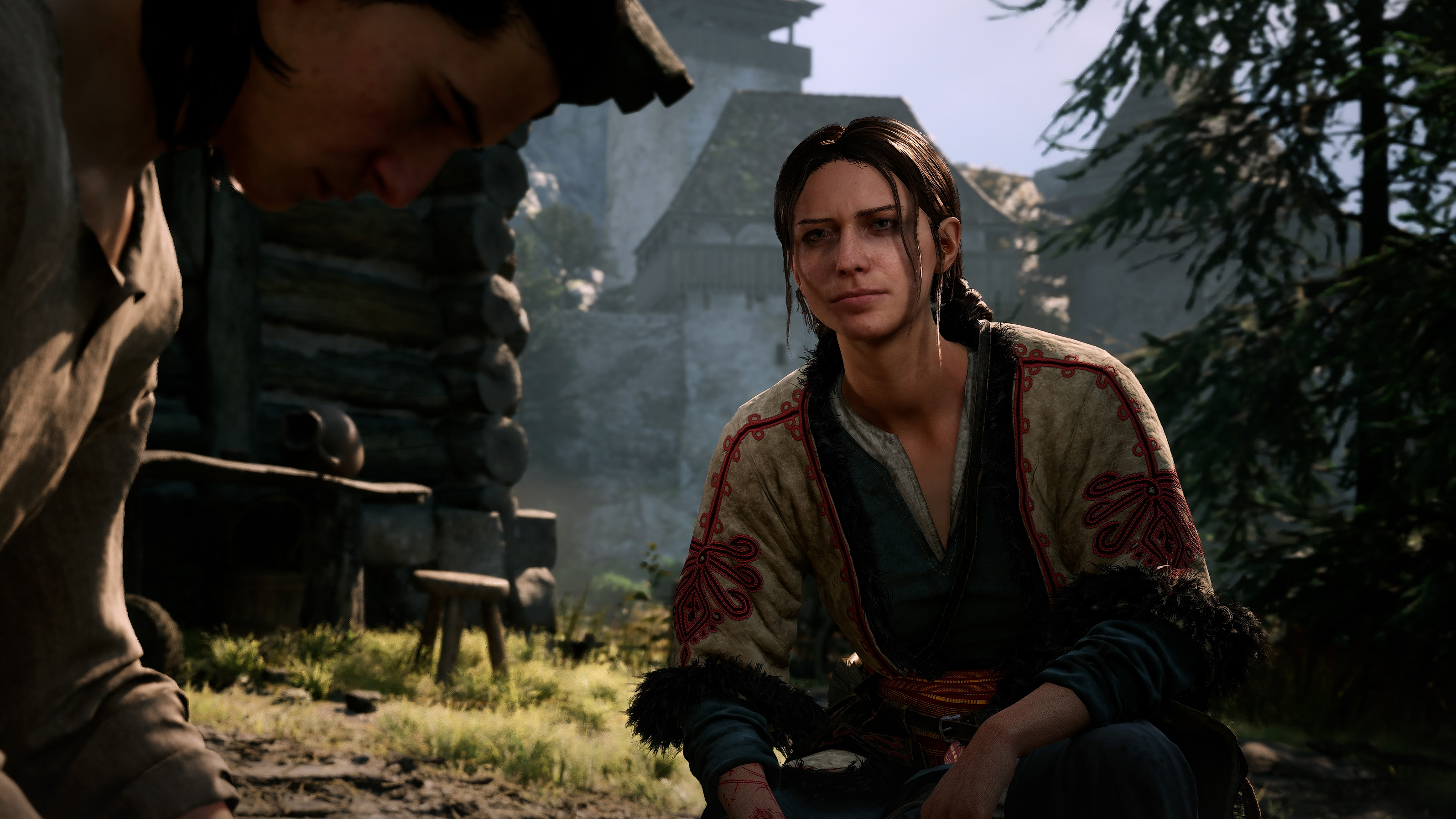 A character in The Blood of Dawnwalker crouches, looking at another in the foreground