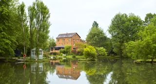 exterior-of-mill-house-on-lake