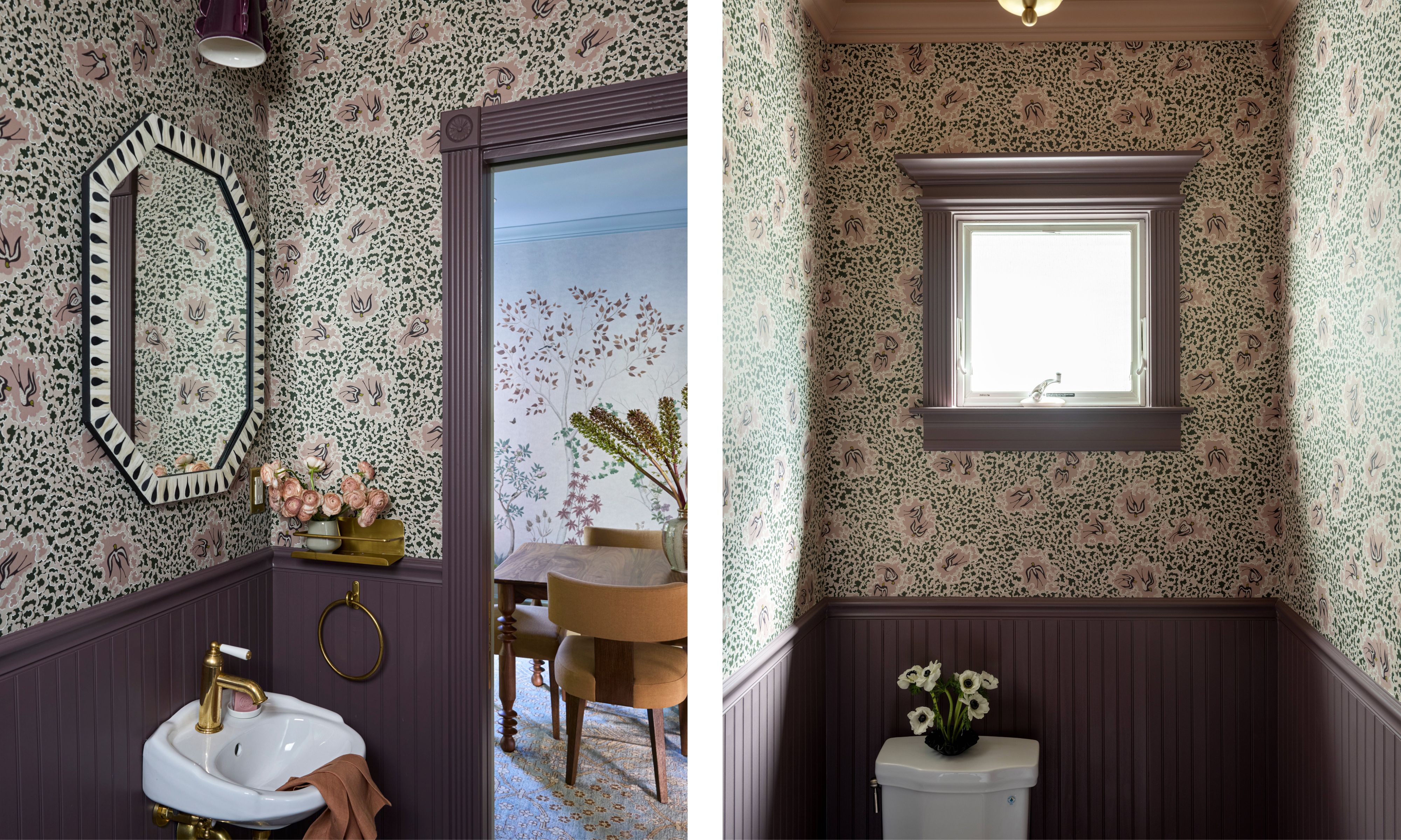 A powder room with pink and green floral wallpaper above deep purple beadboard wainscoting, featuring a small sink with gold fixtures on the left, and a window above the toilet on the right