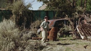 Scotty standing in the back. of the field in The Sandlot