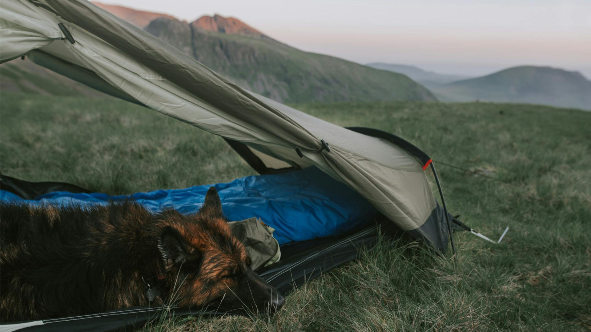 tent with sleeping bag in mountains