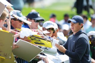 Rory McIlroy signs autographs for fans at the PGA Championship