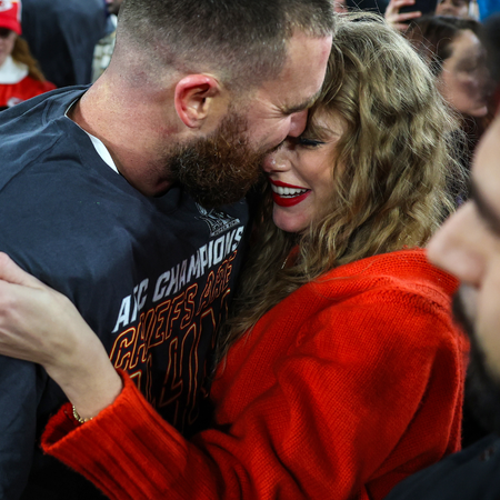 Travis Kelce #87 of the Kansas City Chiefs (L) celebrates with Taylor Swift after defeating the Baltimore Ravens in the AFC Championship Game at M&T Bank Stadium on January 28, 2024 in Baltimore, Maryland.