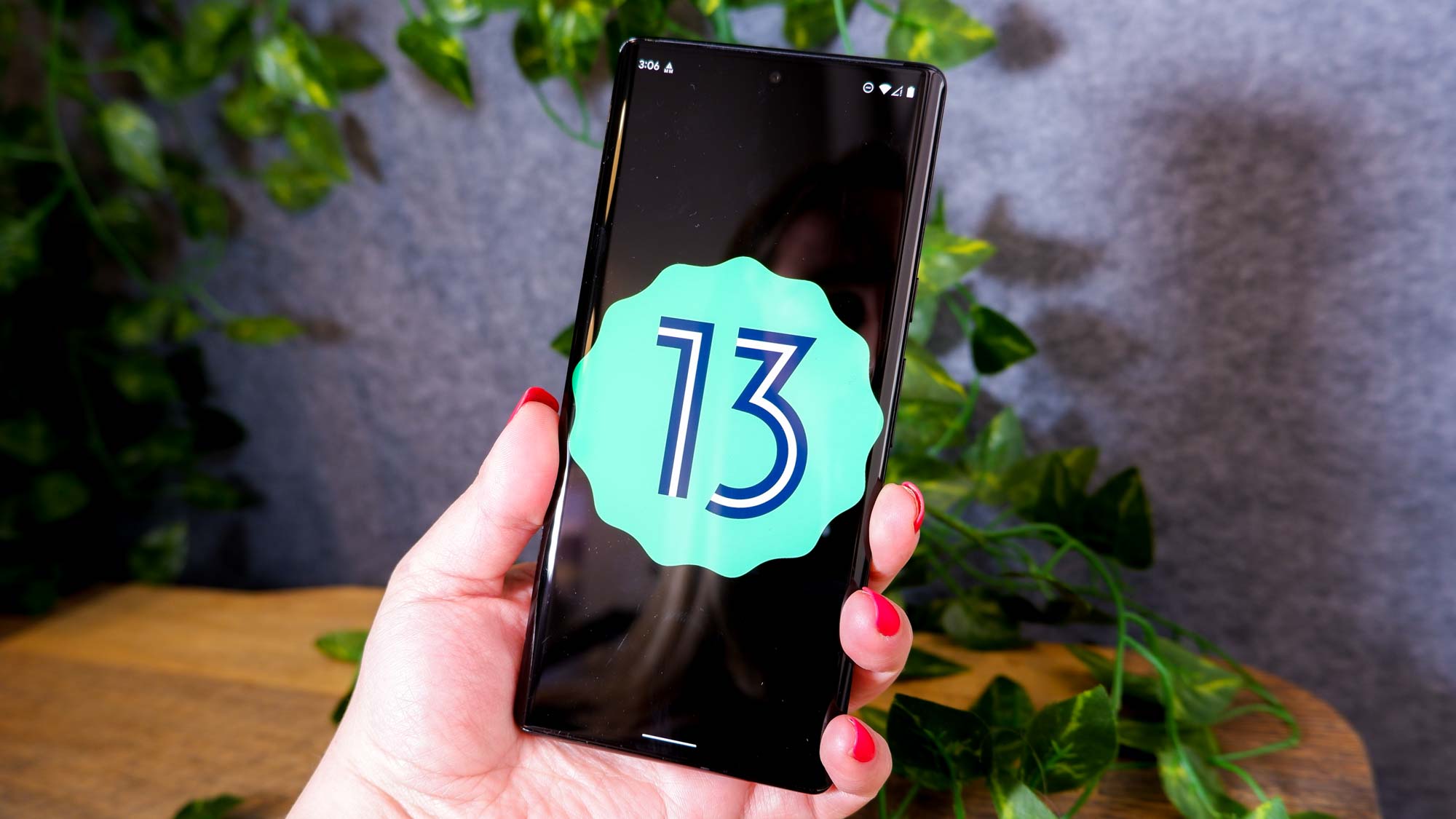 Android 13 logo on a smartphone