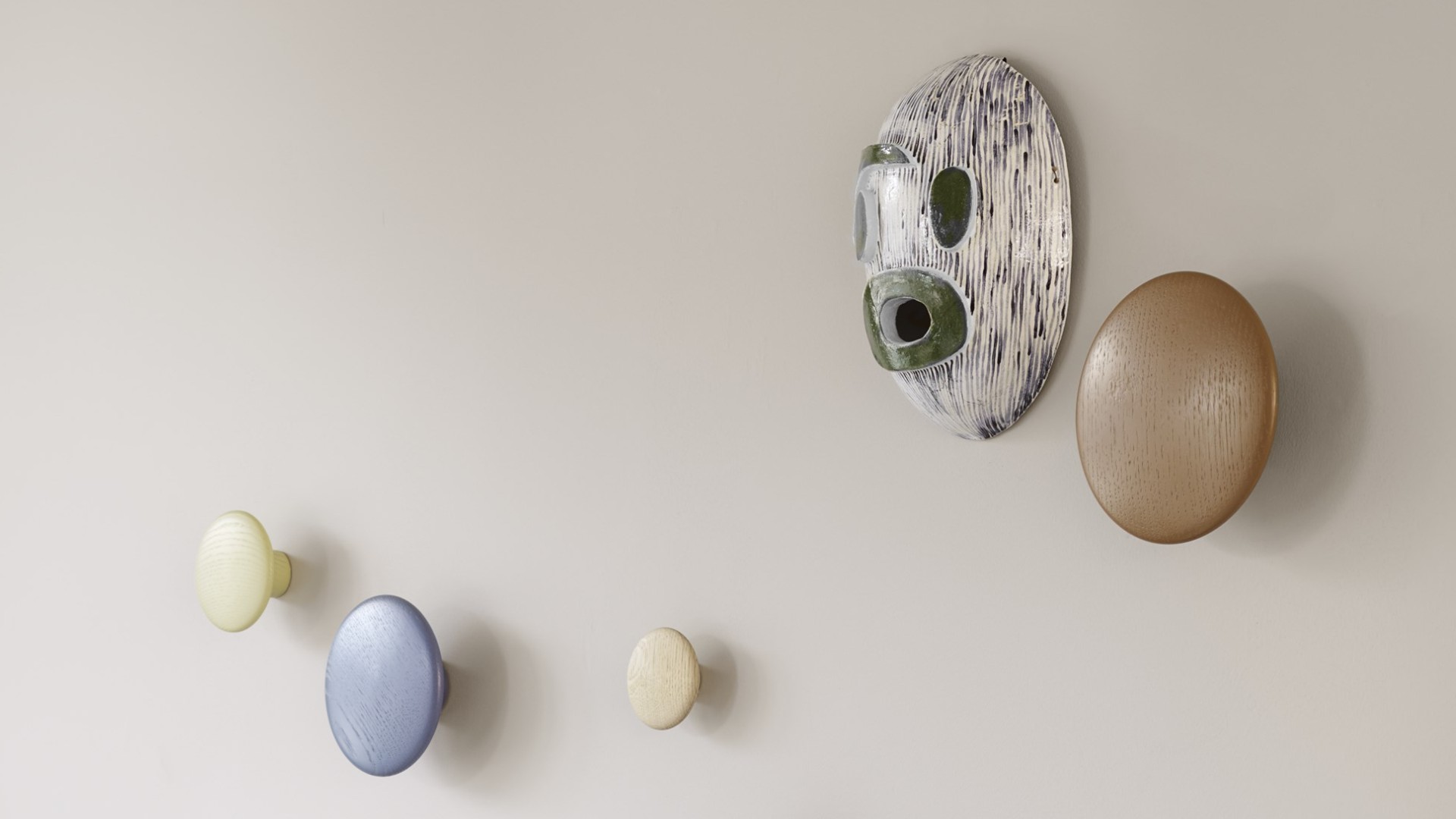 Lifestyle shot showing a selection of Muuto&#039;s Dots on an interior wall